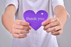 bigstock Children holding thank you heart purple